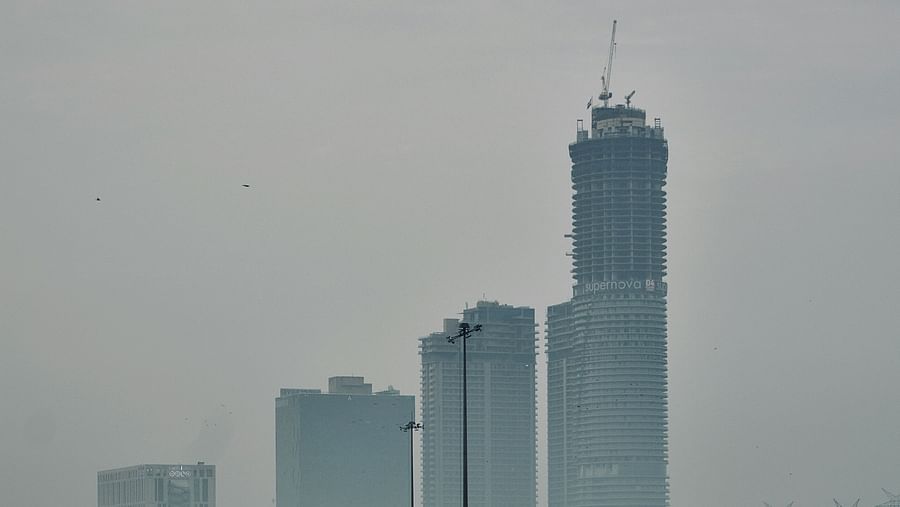 An overview of the city of Noida with skyscrapers and a highway in view.