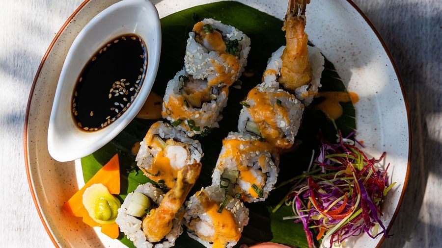 a plate of sushi and dip