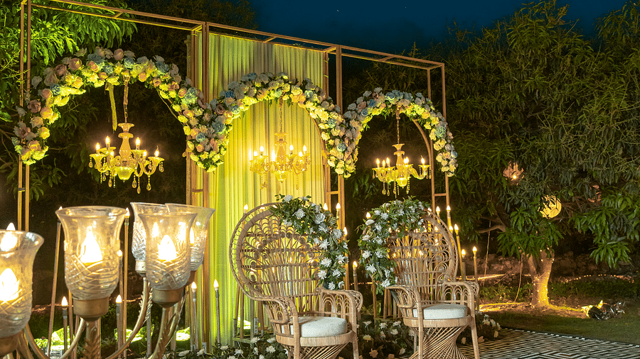 A view of a wedding stage at night at The Sylvan Retreat, Dehradun.
