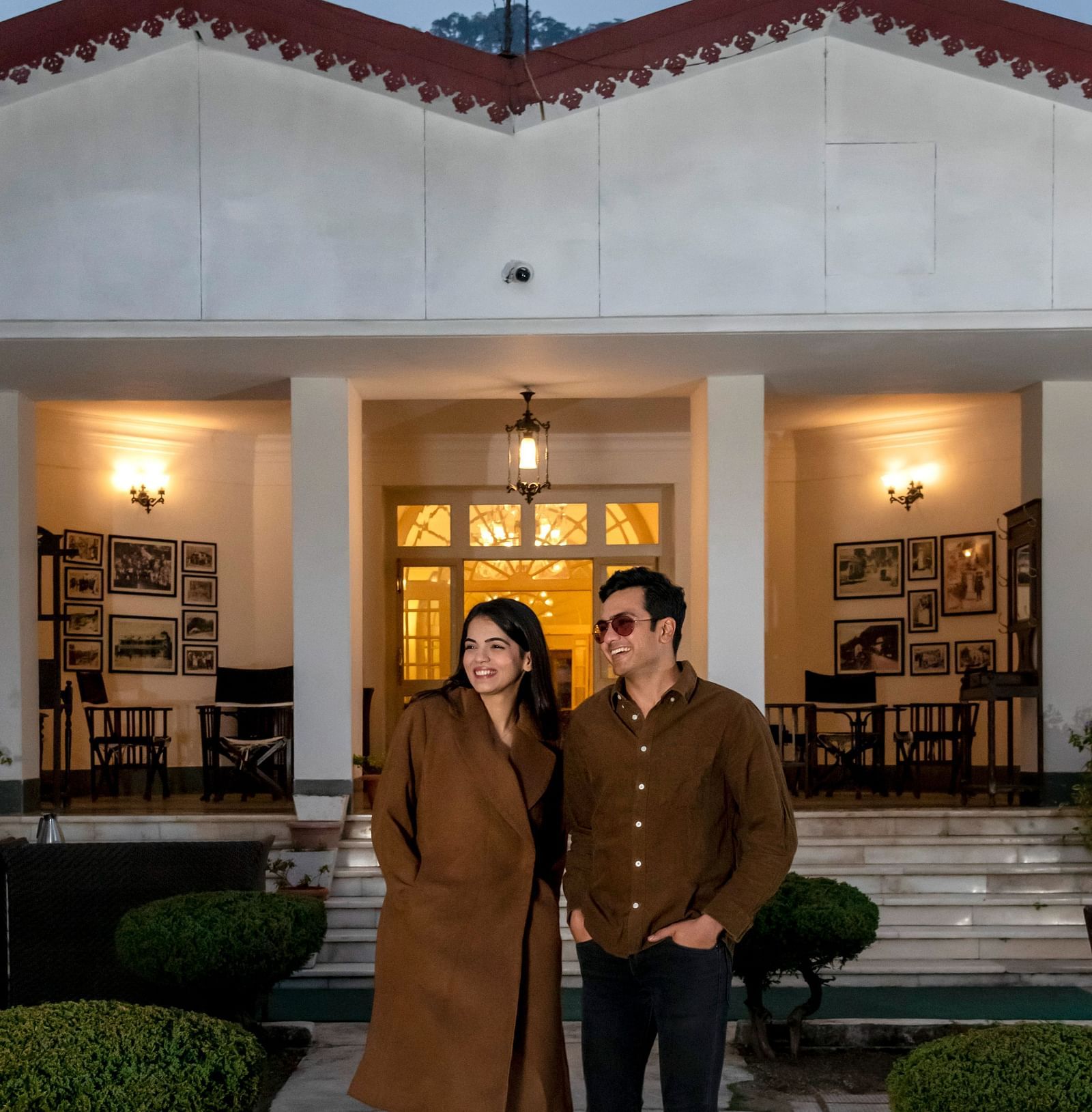 image of a couple outside our hotel in Mussoorie during a sunset