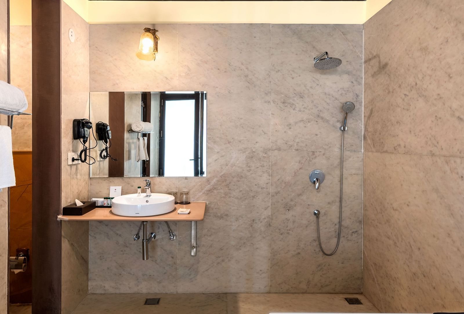 Elegant bathroom with ambient lighting and private plunge pool at Kesar Bagh Palace.