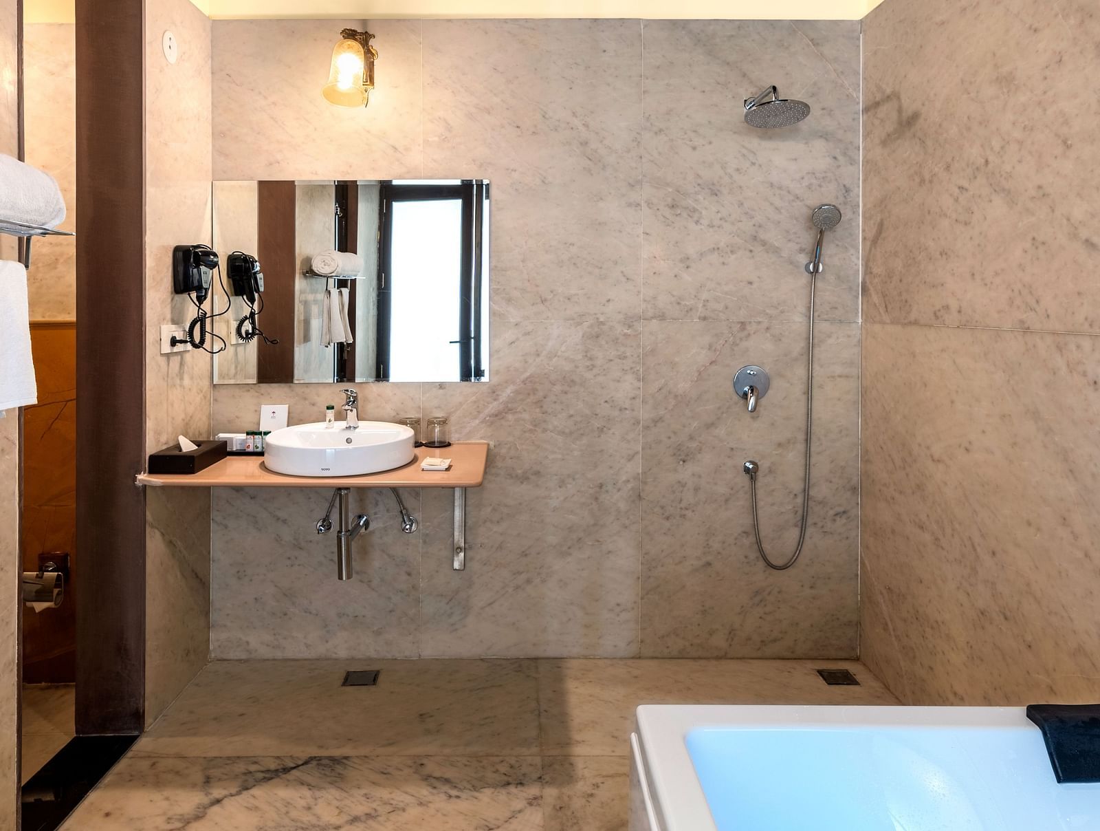 Elegant bathroom with ambient lighting and private plunge pool at Kesar Bagh Palace.