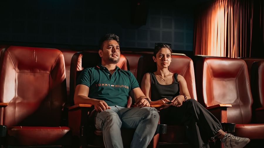 A couple enjoying movie time and having fun in the mini theatre at Crescent Spa & Resort, Indore