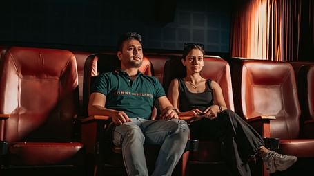 A couple enjoying movie time and having fun in the mini theatre at Crescent Spa & Resort, Indore