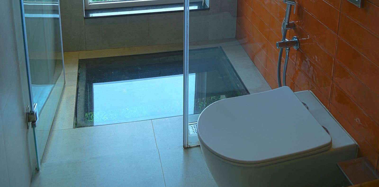 An image of a washroom and a private jacuzzi over viewing the serene landscape - Great Trails Yercaud by GRT Hotels