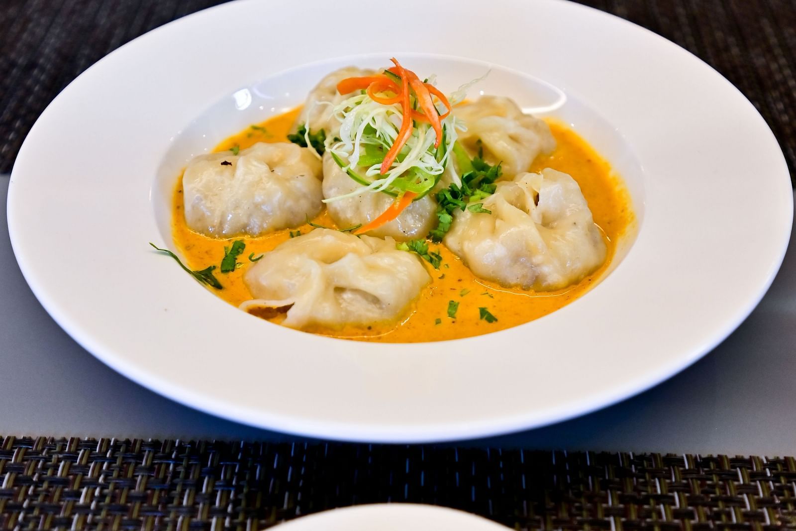 Vegetable momos with sauce topping at The Soma Hotel by Avianna Group, Darjeeling