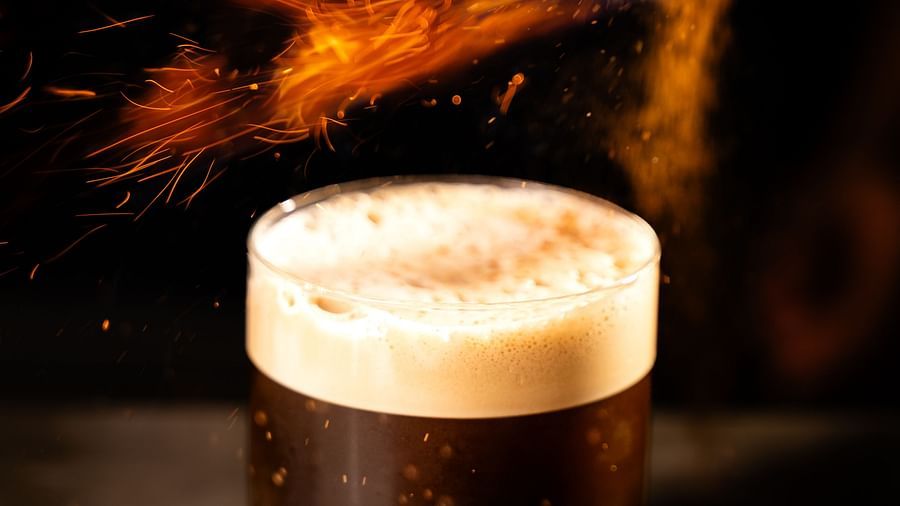 An image of a glass of flavoured beer with foam accumulated till the brink of the glass - The Dukes Retreat, Khandala