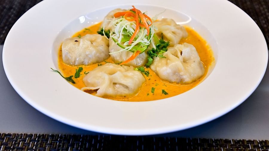 Vegetable momos with sauce topping at The Soma Hotel by Avianna Group, Darjeeling