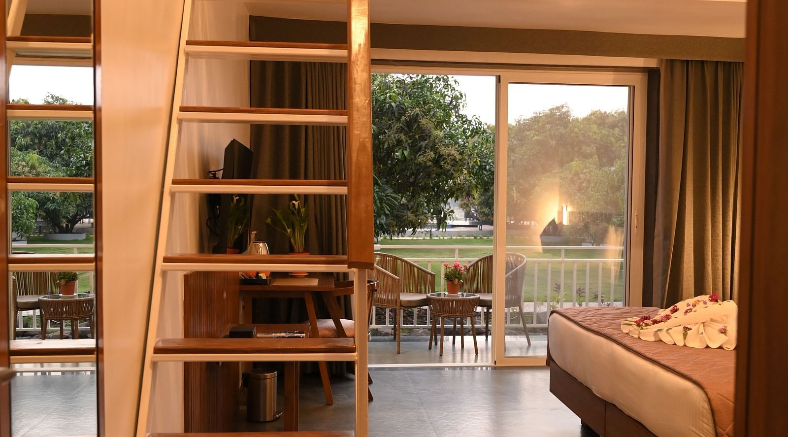 A staircase leading to the attic of the Kutumbh Suite at Mango Leaf Lake Resort, Pune