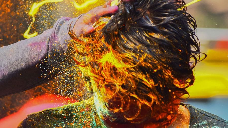 people celebrating with colours at a festival