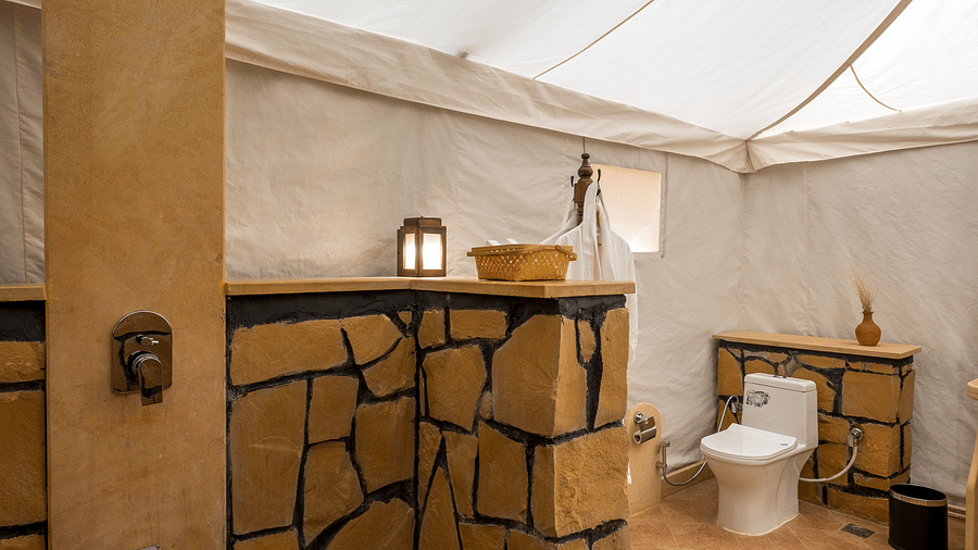The shower and commode inside the washroom - Karwaan Jaisalmer