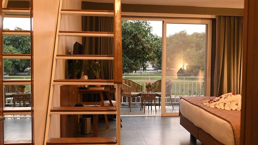 A staircase leading to the attic of the Kutumbh Suite at Mango Leaf Lake Resort, Pune