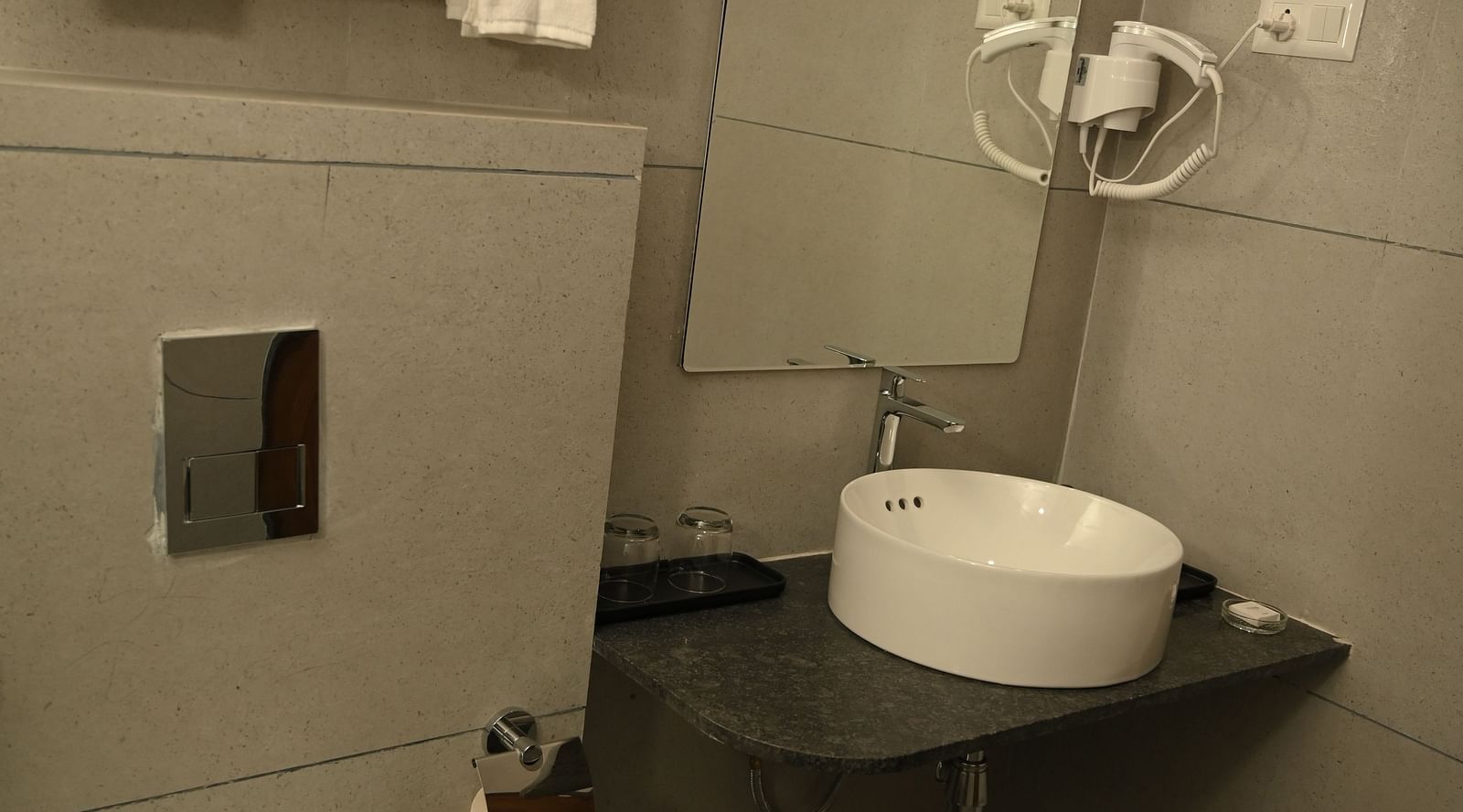 Wide view of the washroom at the Deluxe Cottage at Mango Leaf Lake Resort, Pune