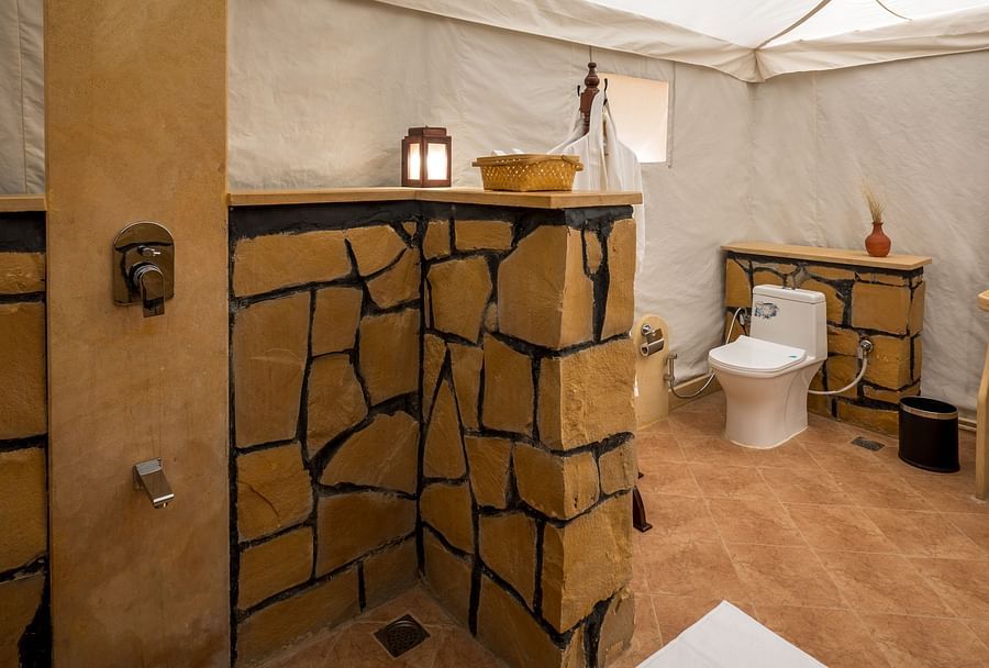 alt-text The shower and commode inside the washroom - Karwaan Jaisalmer