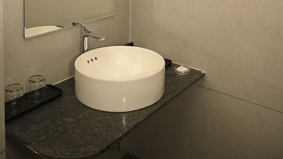 Sink in the washroom at the Deluxe Cottage at Mango Leaf Lake Resort, Pune