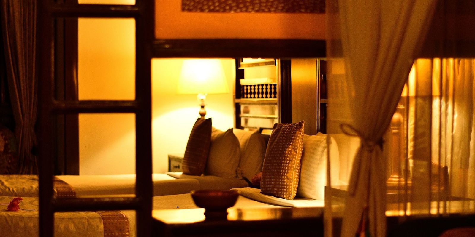 An image of well lit bedroom - Hoysala Village Resort, Hassan