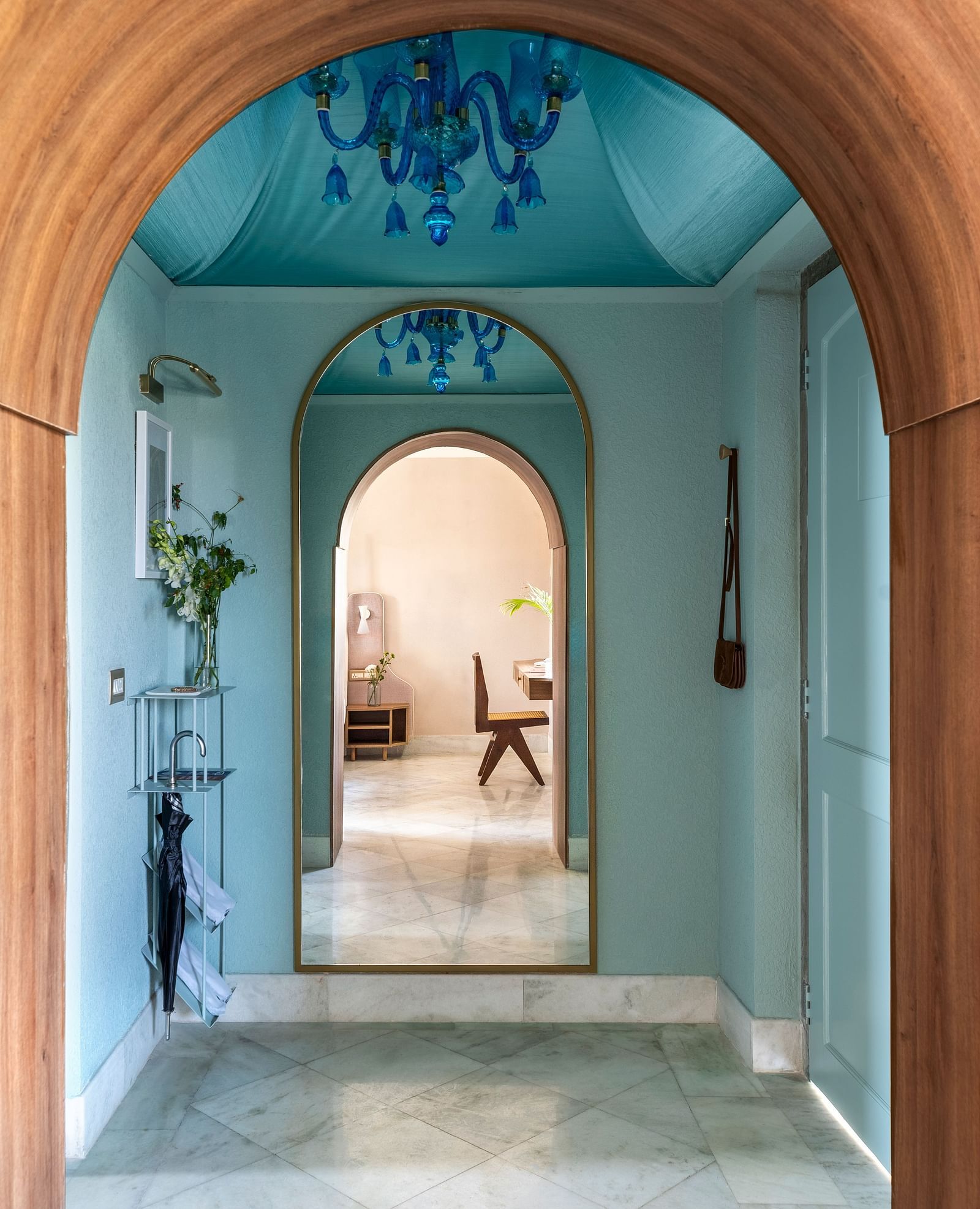 a close up shot of an arch with a chandelier in view - Manuscript - Jhilwara Haveli, Udiapur