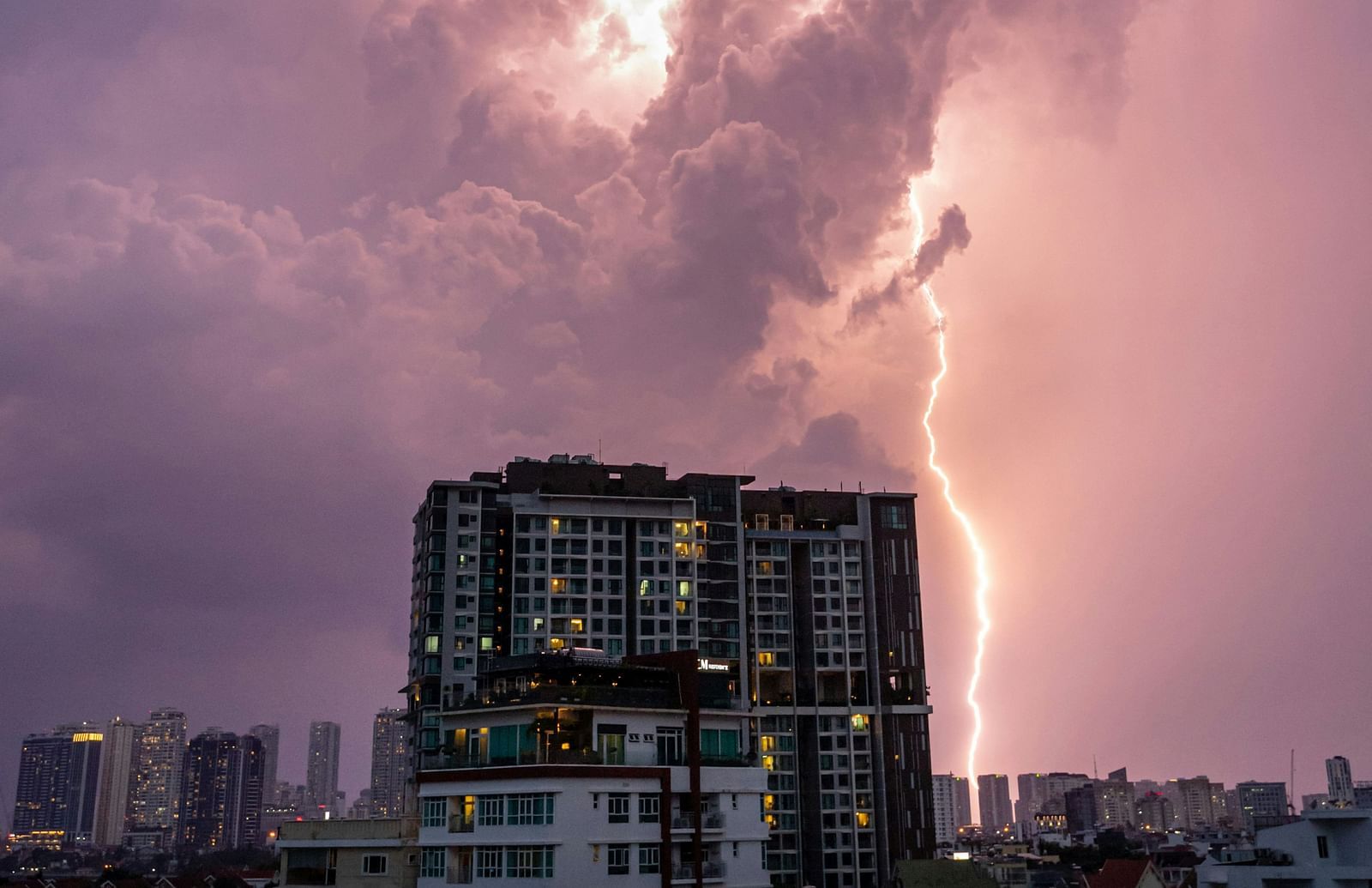 A fascinating picture of a thunderstorm in Ho Chi Minh City with a lightning behind a skyscraper