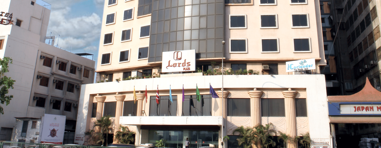 Exterior view of a modern hotel building by Lords Hotels and Resorts.