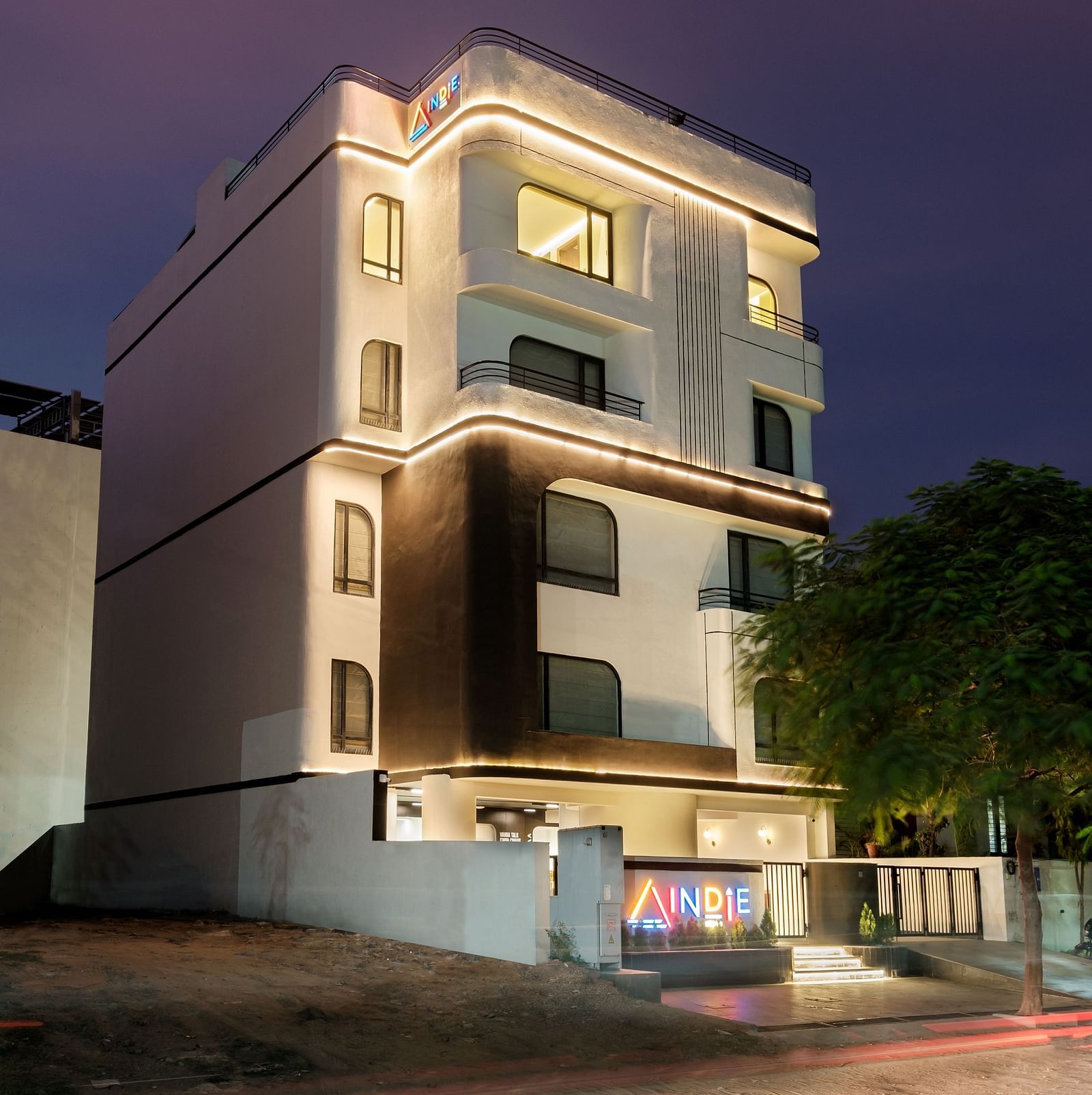 The Facade of Indie Stays Jaipur stands strikingly against the night sky, offering a captivating view of the building’s design