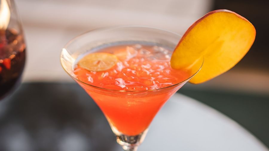a glass of a cocktail served by Victorian Bar at The Claridges Nabha Residence