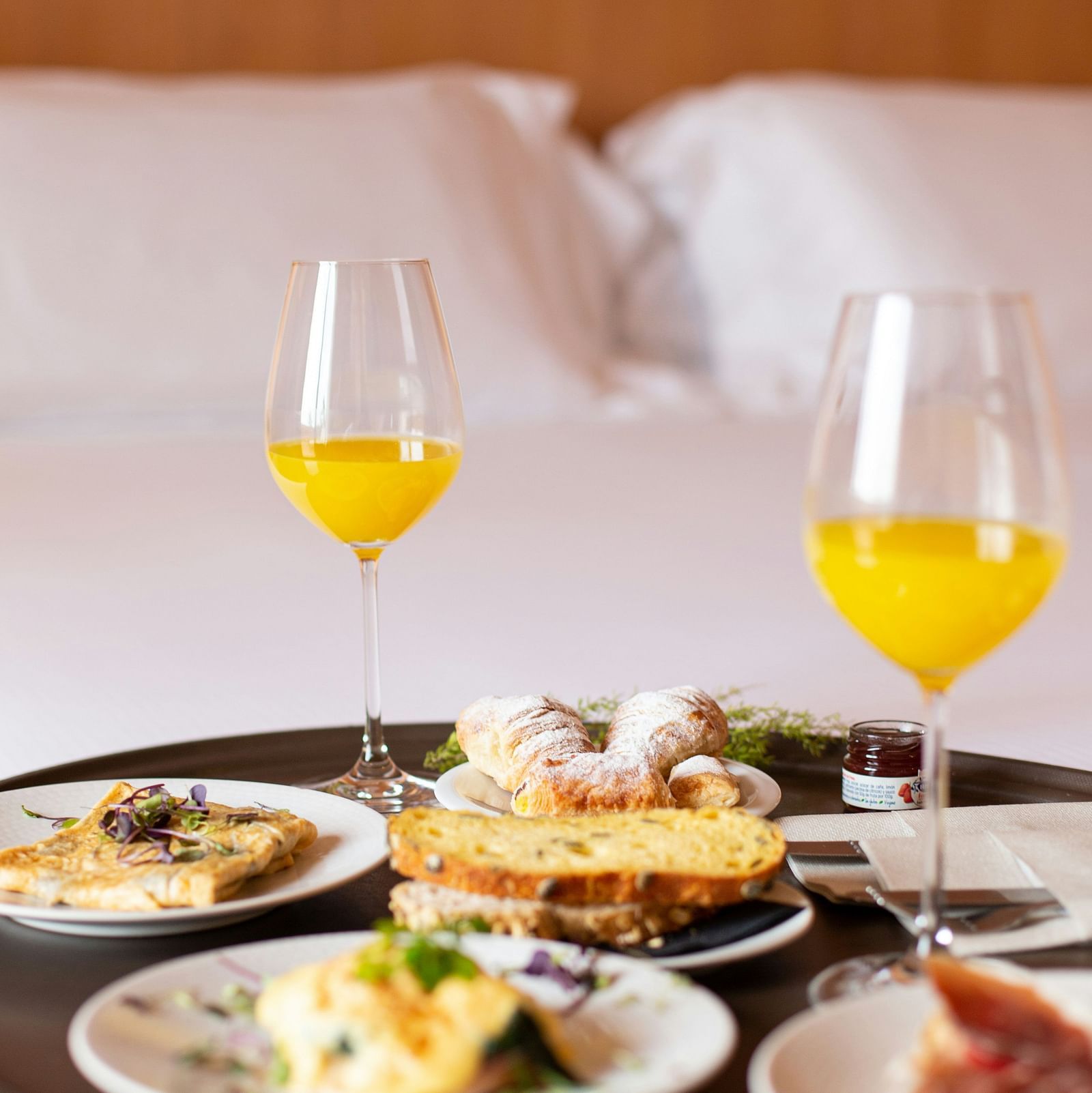 An image of different varieties of food with drinks 