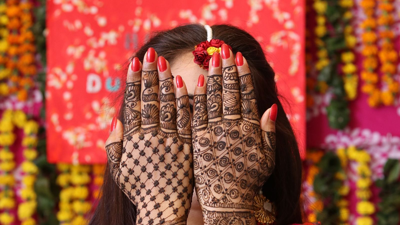 A close up shot a bride showing off her mehendi during her wedding - Weddings in South Goa - Caravela Beach Resort, Goa.