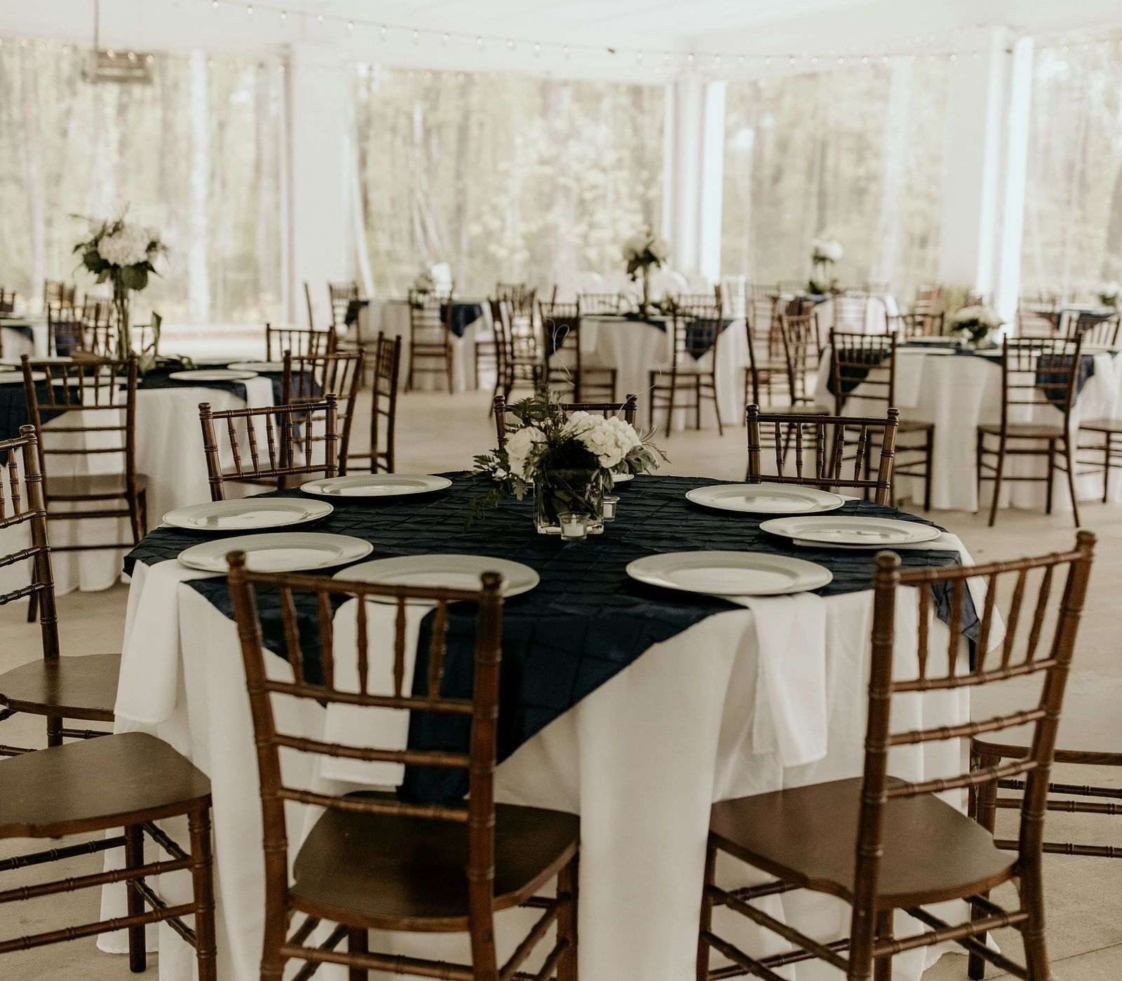 Elegant dining setup with neatly arranged tables and chairs