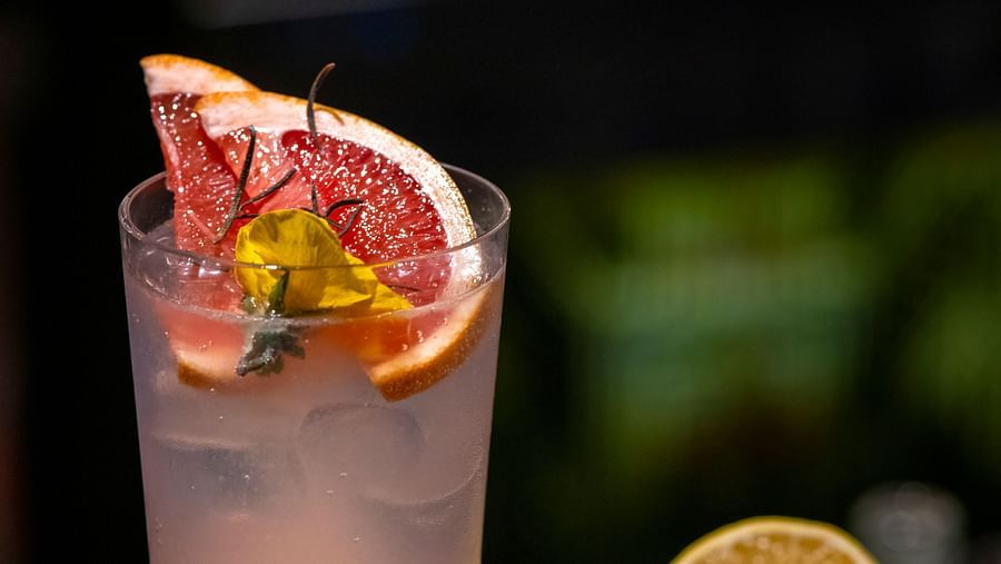 Image of a drink with fruits on the side - The Claridges, New Delhi