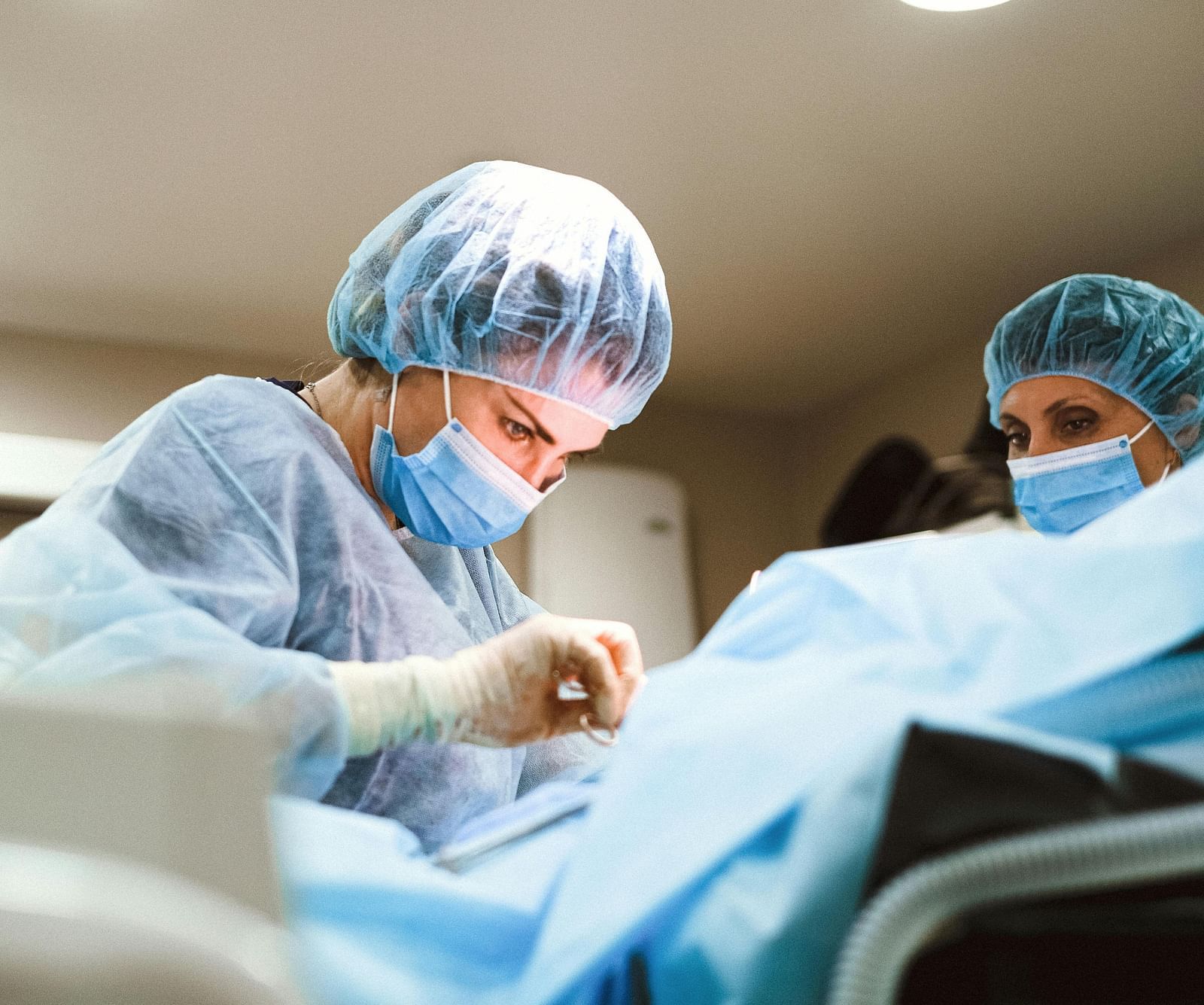 An image of a doctor performing  operation with their partner