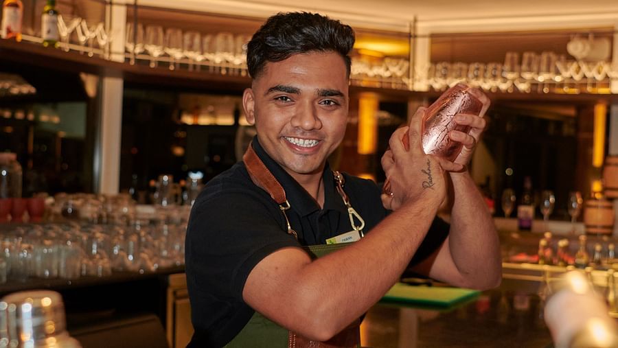 an image of a male bartender displaying his skills at The Dukes Retreat