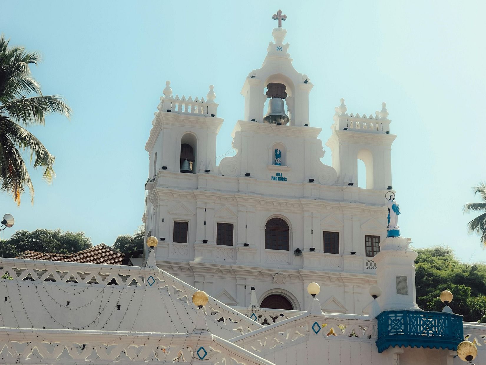 Exterior of a white church on a sunny day