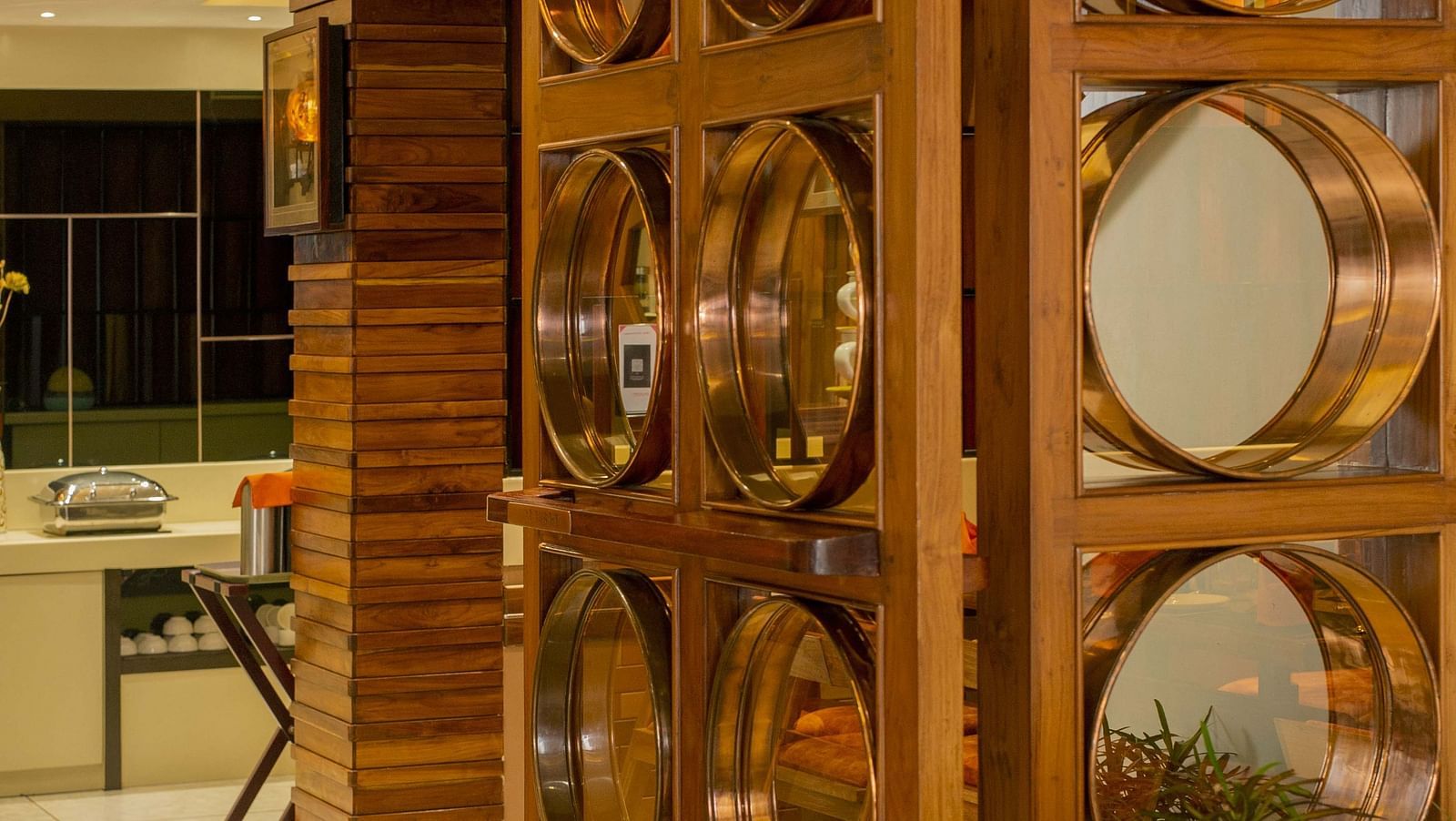 Door to Honeycomb Restaurant at Coral Reef Hotel & Spa in Port Blair with mirrors attached 