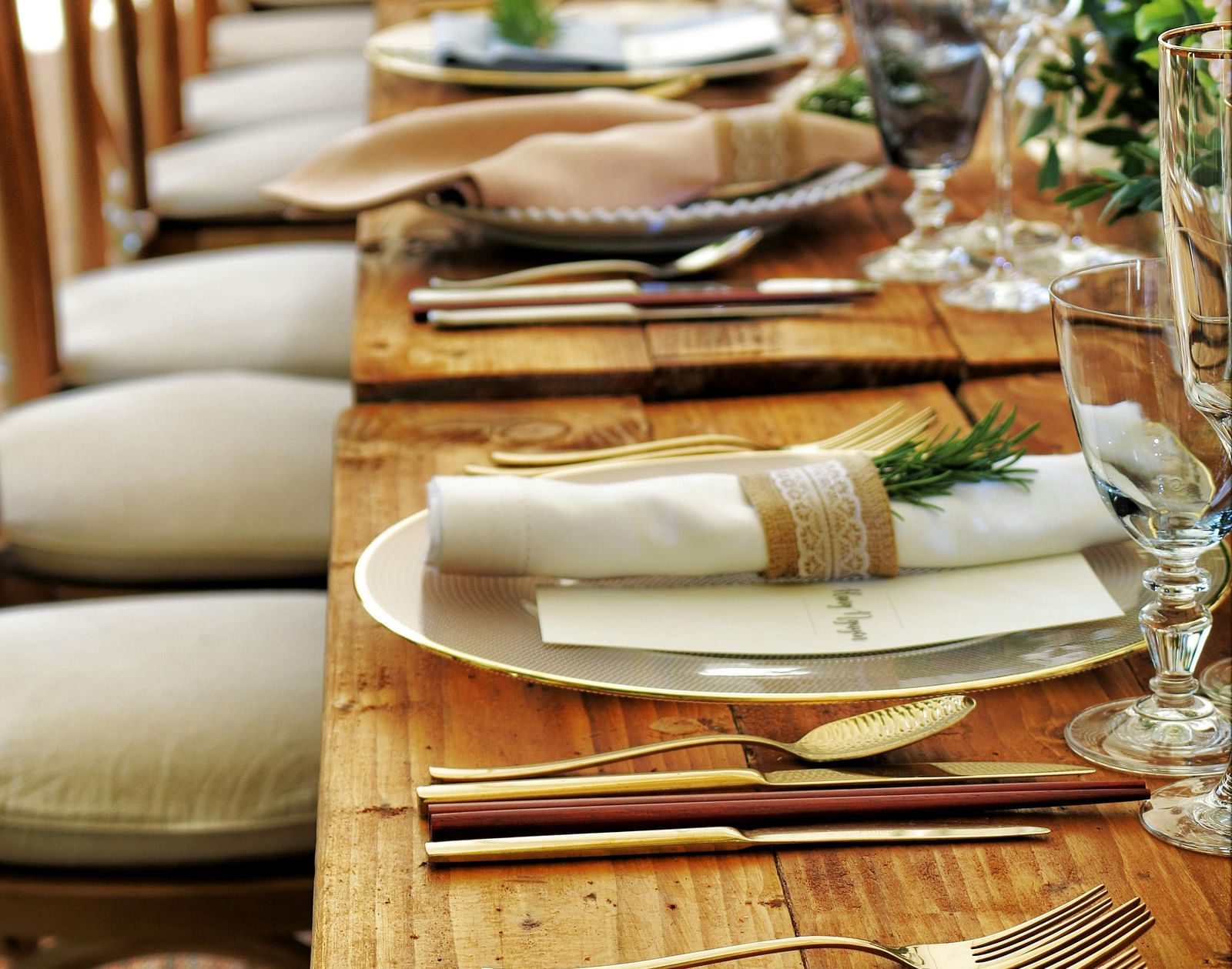 A dining area neatly arranged with plates and forks kept beside.