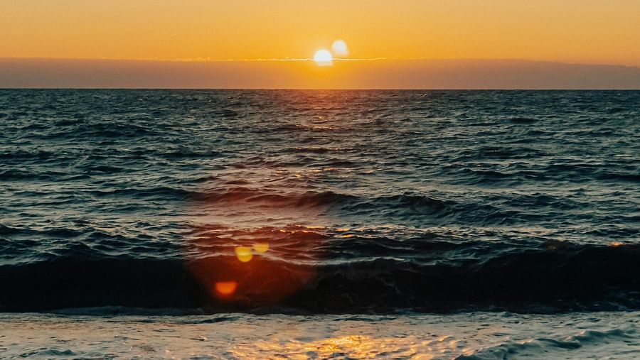 Scenic view of a sunset on an ocean.