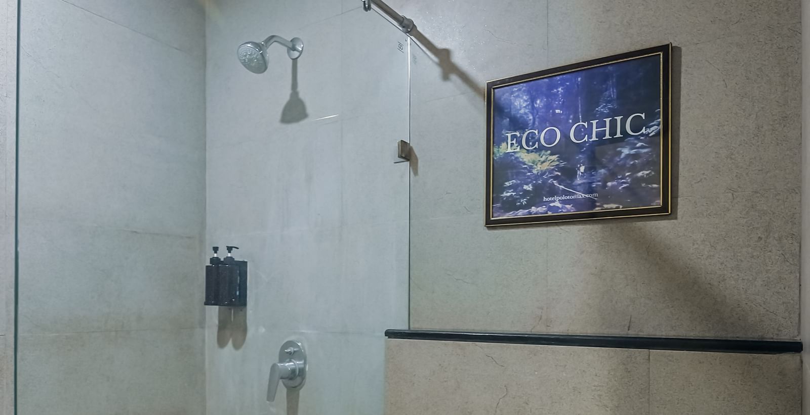 Bathroom with wall-mounted showerhead at Max Hotel Prayagraj.