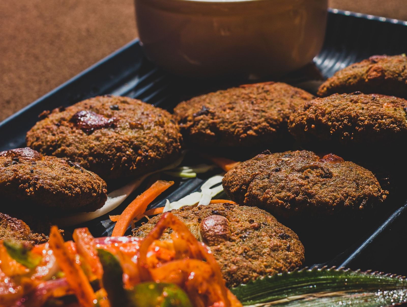 A platter of Indian appetizers served along with chutney.
