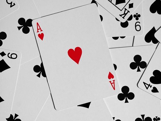 An ace card placed on top of other cards in black