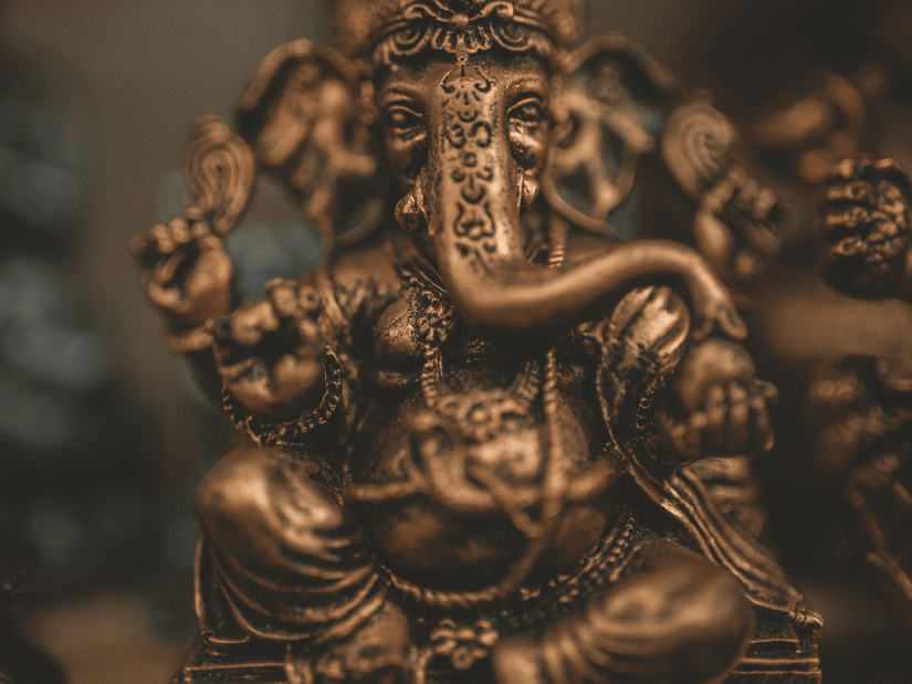 Traditional bronze Ganesha sculpture with fine handcrafted details.