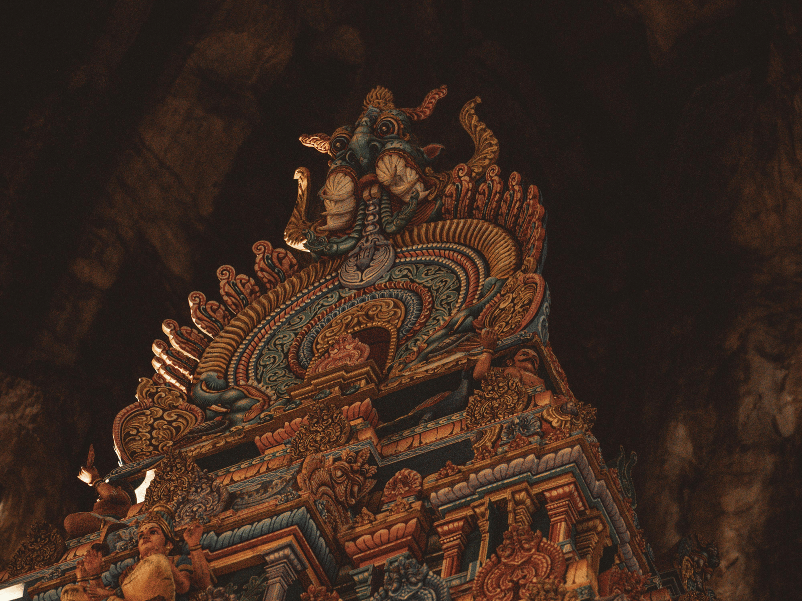 Temple tower illuminated at night.