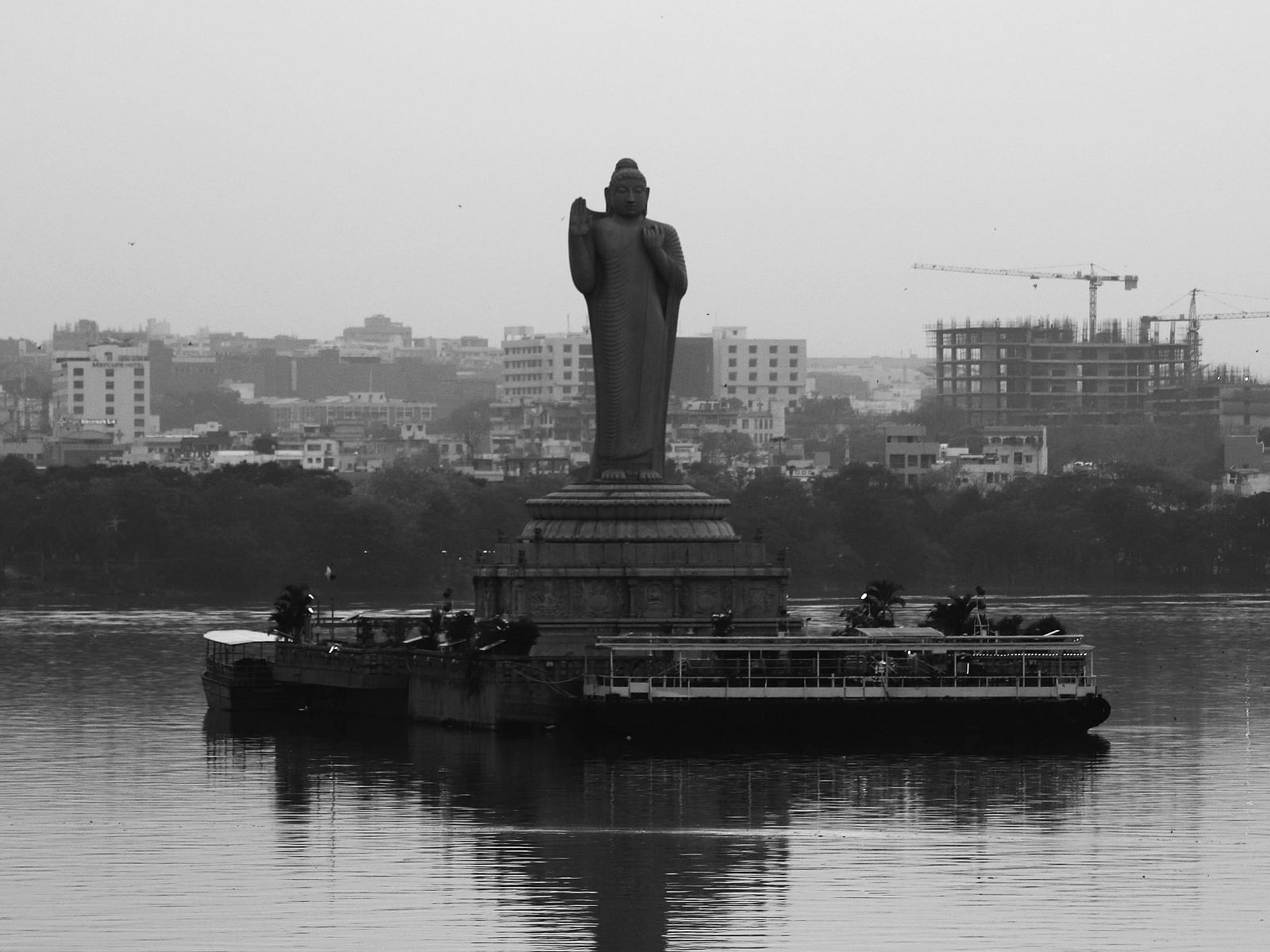 The majestic Buddha statue overlooking Hussain Sagar Lake in Hyderabad, India.