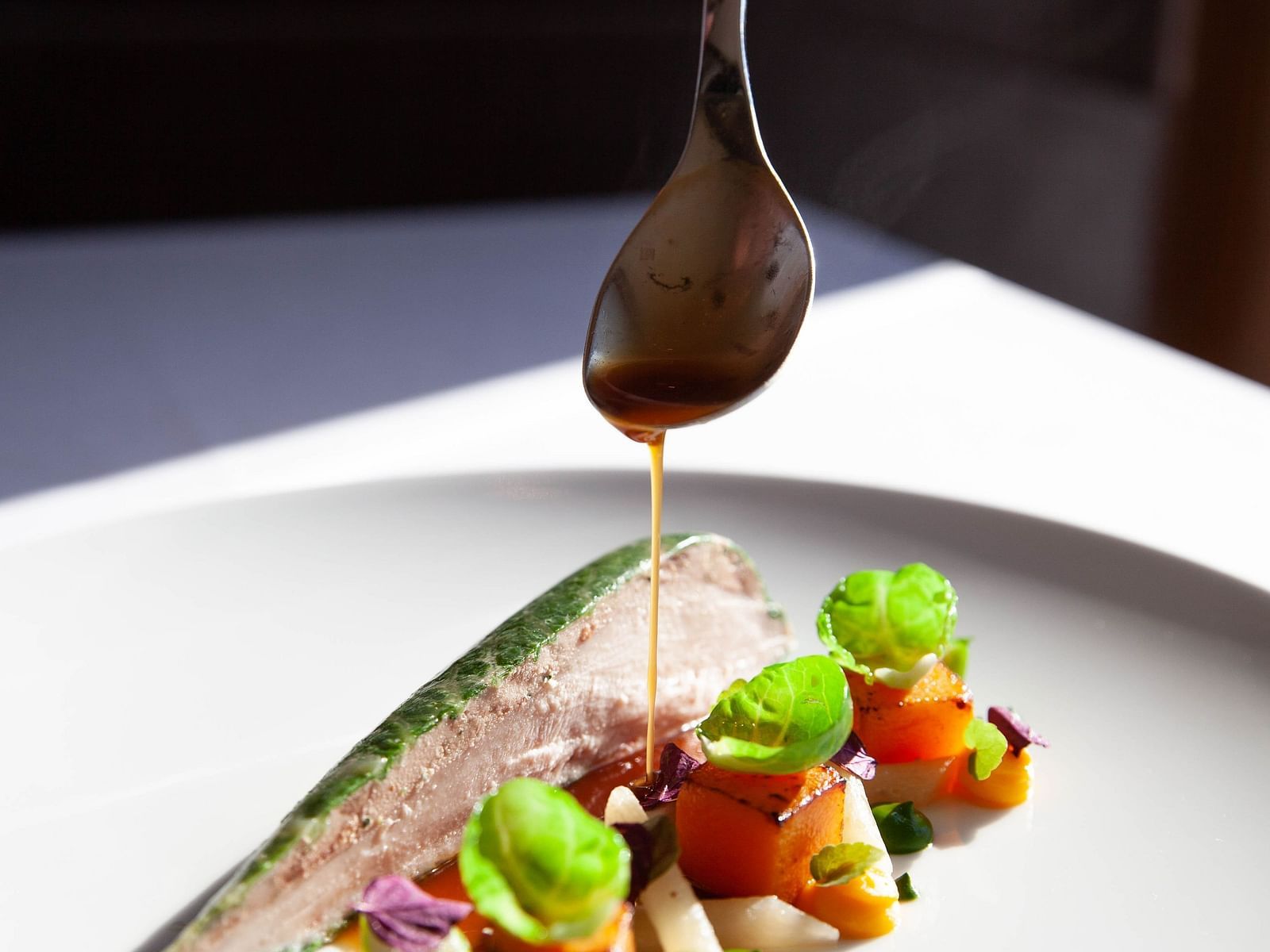 A chef plating their dish