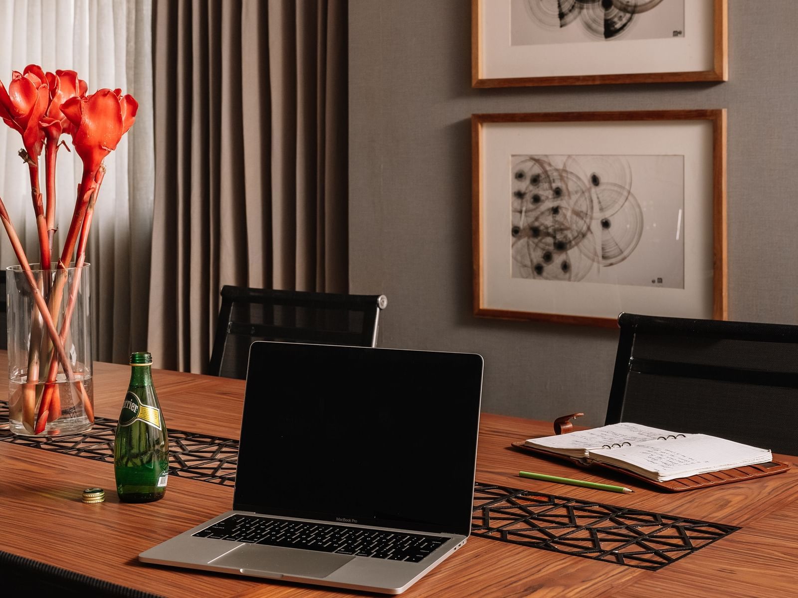 A modern business meeting room with sleek workstations and comfortable seating at The Raintree, St. Mary's Road.