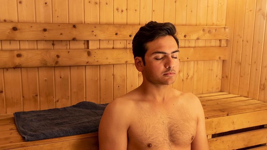 image of a man sitting for a rejuvenating spa treatment at The Claridges Nabha Residence