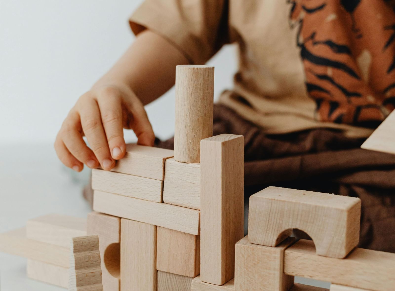 A kid playing with building  blocks