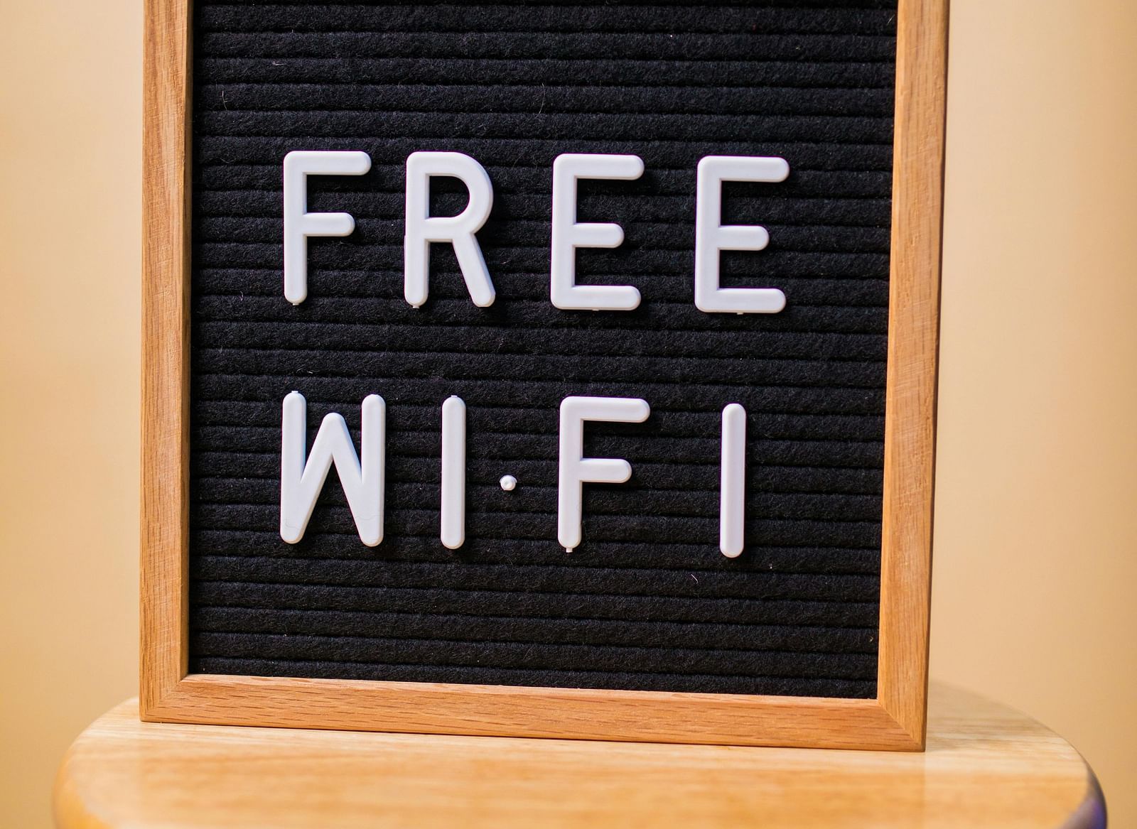 An image of a signboard with 'Free Wi Fi' written on it.