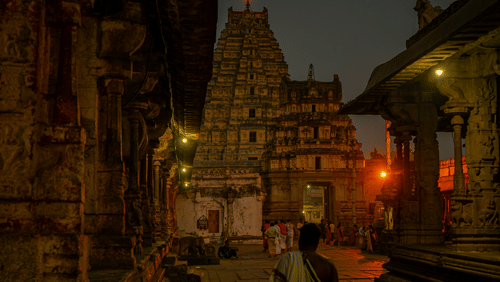 Man walking towards the magnificent Tirupati Temple