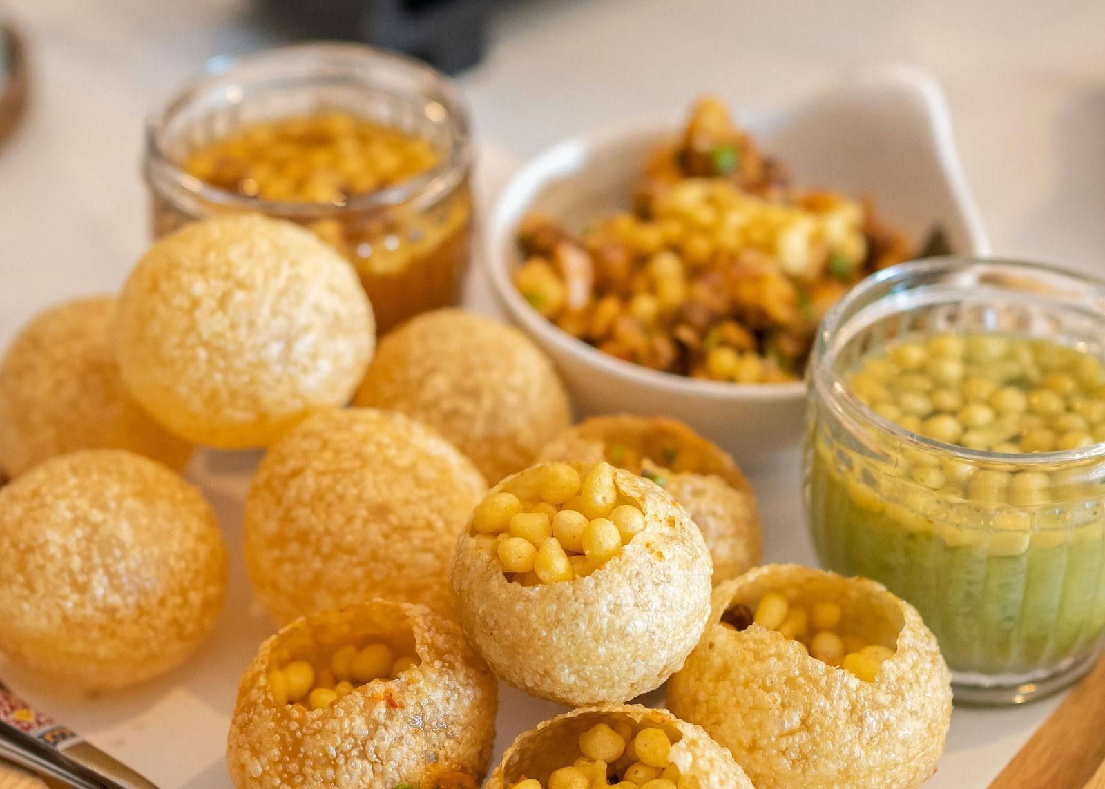 View of pani puri plated on a platter.
