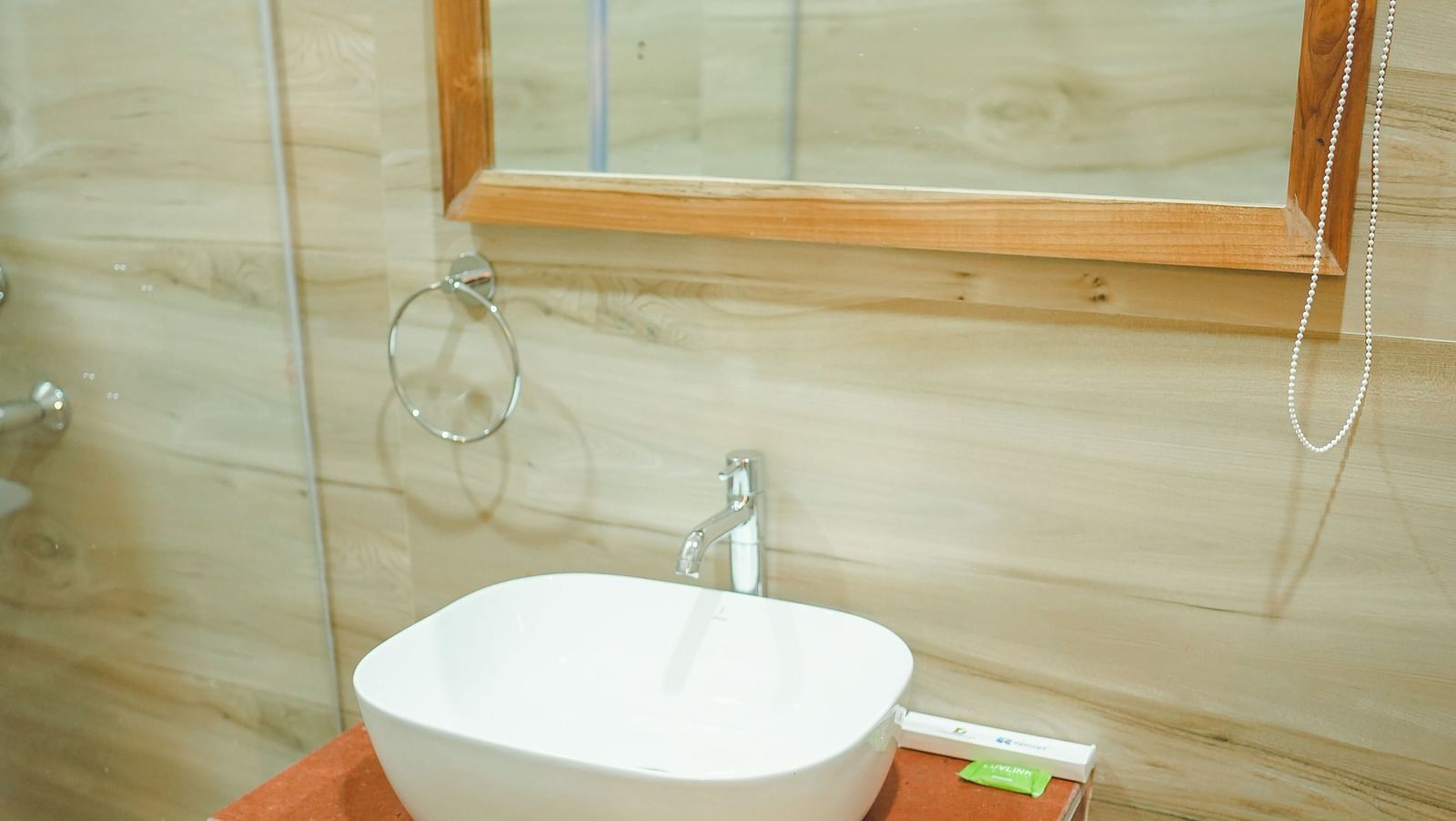 image of a wash basin with a covered vanity area below it