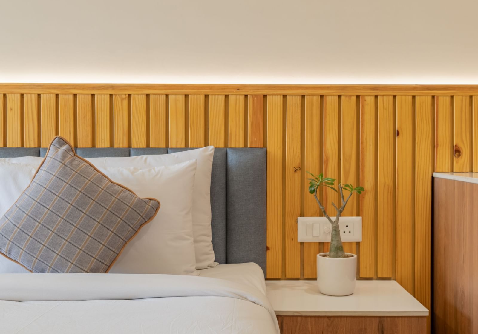 A deluxe room with a half view of the bed and a coffee table at Hotel Highway King, Bagru